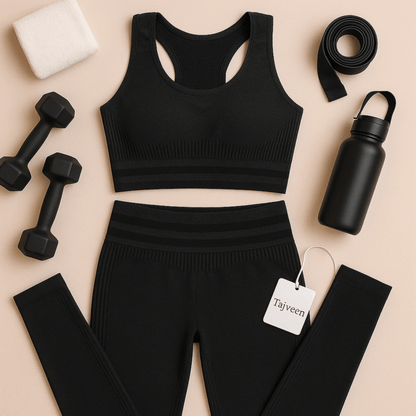 Black athletic outfit with leggings, sports bra, dumbbells, water bottle, and measuring tape on a beige background.