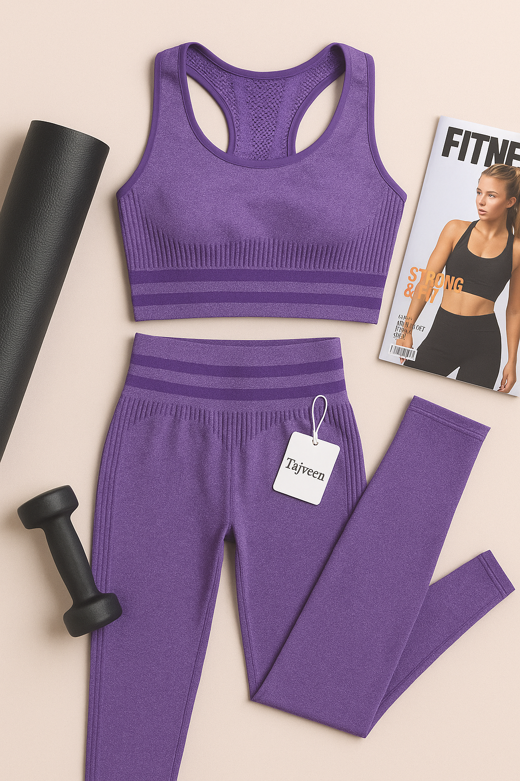 Purple athletic outfit with leggings and sports bra, accompanied by a magazine and dumbbells on a beige background.
